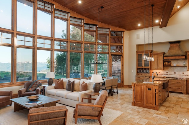 8376 E Aspen Rdg Unit 44, Heber City, UT 84032 - living area with wooden ceiling, a high ceiling, recessed lighting, healthy amount of natural light, and stone tile flooring