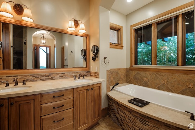 8376 E Aspen Rdg Unit 44, Heber City, UT 84032 - bathroom featuring backsplash, a garden tub, and double vanity