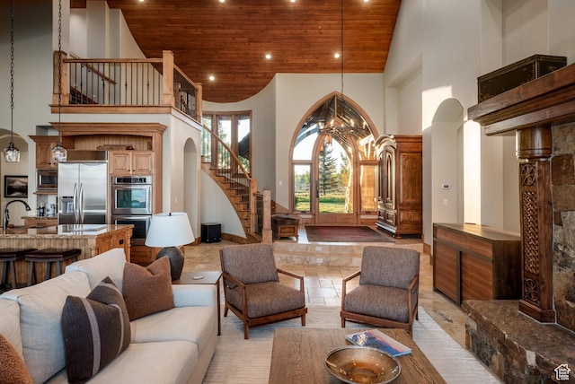8376 E Aspen Rdg Unit 44, Heber City, UT 84032 - living area with wooden ceiling, high vaulted ceiling, stairs, arched walkways, and recessed lighting