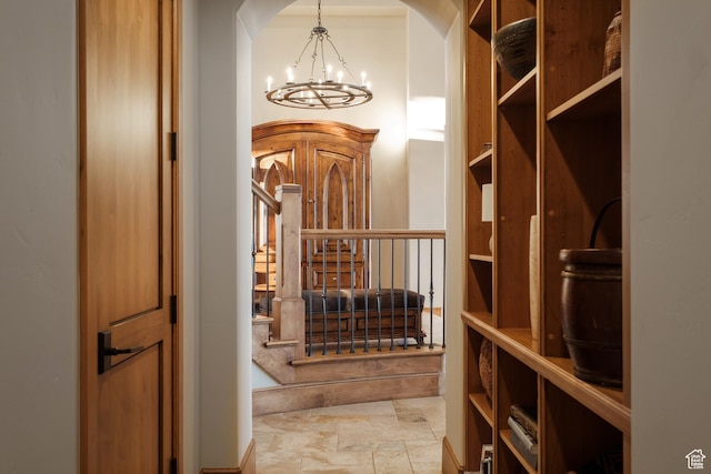 8376 E Aspen Rdg Unit 44, Heber City, UT 84032 - wine area with a chandelier, stone finish flooring, and arched walkways