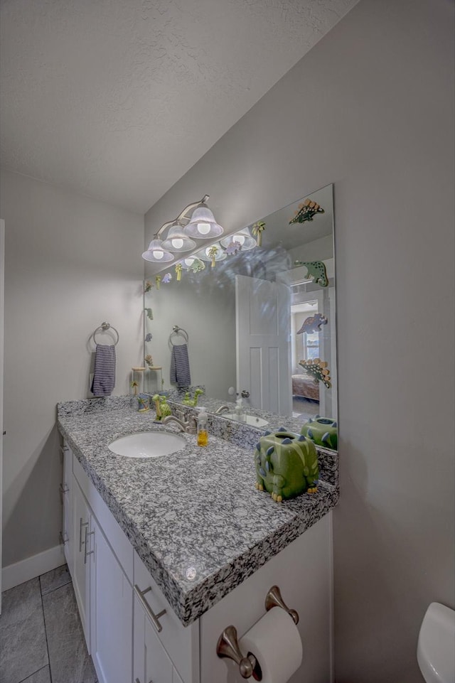1997 E Abbey Way S, Eagle Mountain, UT 84005 - half bath with vanity, baseboards, tile patterned flooring, a textured ceiling, and toilet