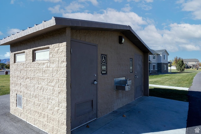 1997 E Abbey Way S, Eagle Mountain, UT 84005 - view of property exterior with a lawn and concrete block siding
