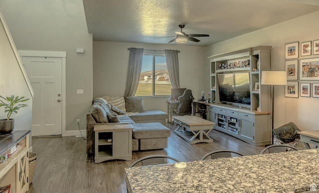 1997 E Abbey Way S, Eagle Mountain, UT 84005 - living area with baseboards, wood finished floors, and a ceiling fan