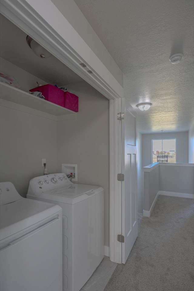 1997 E Abbey Way S, Eagle Mountain, UT 84005 - clothes washing area featuring baseboards, light carpet, laundry area, a textured ceiling, and separate washer and dryer
