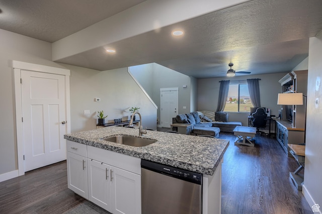 1997 E Abbey Way S, Eagle Mountain, UT 84005 - kitchen with dark wood-style floors, white cabinetry, a kitchen island with sink, a sink, and stainless steel dishwasher