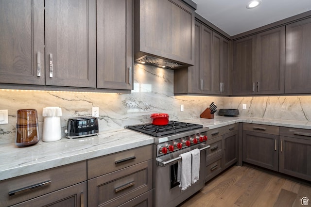 5790 Cobalt Cir, Park City, UT 84098 - kitchen with light wood finished floors, light stone counters, tasteful backsplash, and stainless steel stove