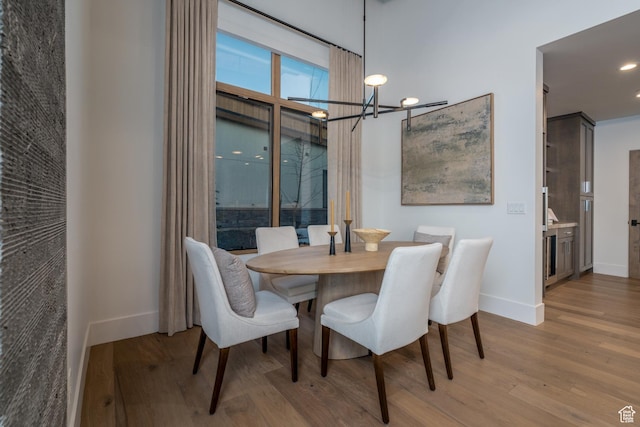 5790 Cobalt Cir, Park City, UT 84098 - dining space featuring a chandelier, baseboards, and wood finished floors