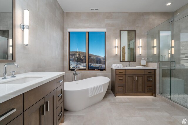 5790 Cobalt Cir, Park City, UT 84098 - bathroom with a shower stall, tile walls, visible vents, and a sink