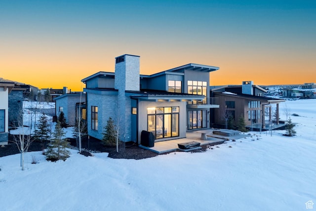 5790 Cobalt Cir, Park City, UT 84098 - snow covered rear of property featuring a chimney