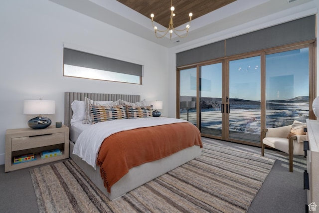 5790 Cobalt Cir, Park City, UT 84098 - bedroom featuring access to exterior, carpet flooring, a tray ceiling, and a chandelier