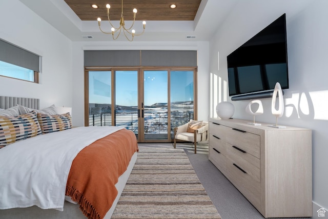 5790 Cobalt Cir, Park City, UT 84098 - bedroom featuring light carpet, a notable chandelier, a tray ceiling, and access to outside