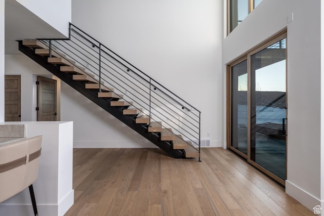 5790 Cobalt Cir, Park City, UT 84098 - stairs with wood finished floors, baseboards, and a towering ceiling