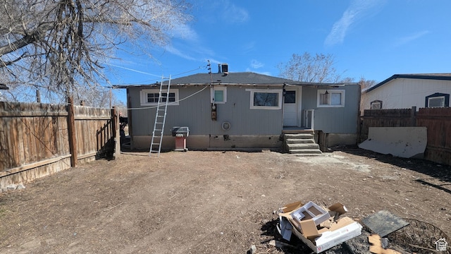 back of property with fence