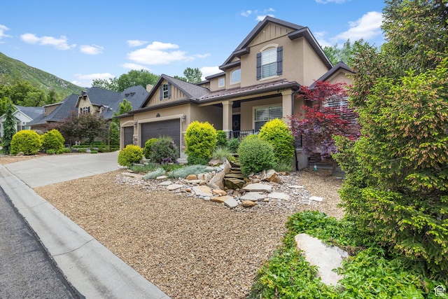 69 W Grove Creek Cir N, Farmington, UT 84025 - craftsman house featuring covered porch, stucco siding, driveway, and a garage