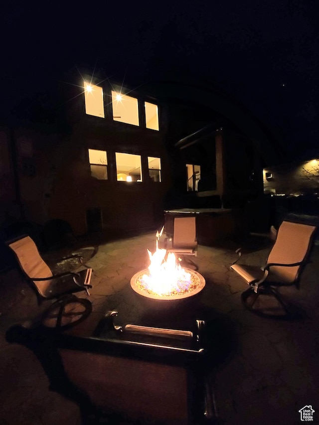 69 W Grove Creek Cir N, Farmington, UT 84025 - back of house with an outdoor fire pit and a patio area