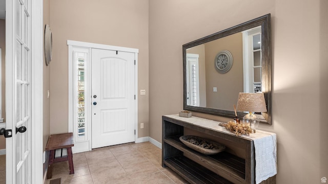 69 W Grove Creek Cir N, Farmington, UT 84025 - entrance foyer featuring baseboards, light tile patterned flooring, and a towering ceiling