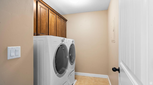 69 W Grove Creek Cir N, Farmington, UT 84025 - washroom with washer and clothes dryer, cabinet space, baseboards, and light tile patterned floors