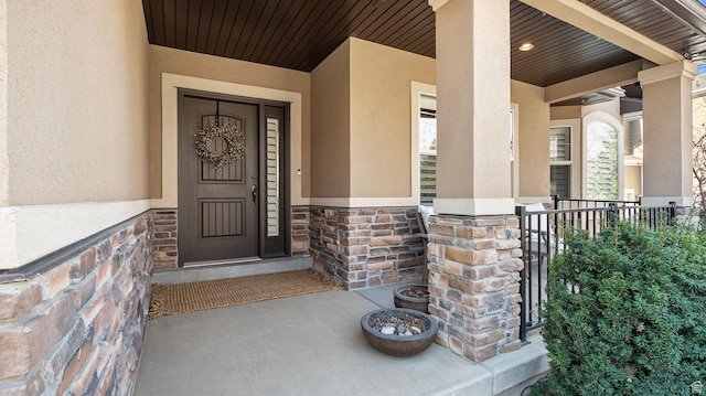 69 W Grove Creek Cir N, Farmington, UT 84025 - entrance to property with stucco siding, covered porch, and stone siding