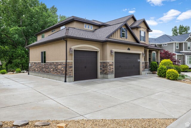 69 W Grove Creek Cir N, Farmington, UT 84025 - craftsman house featuring stone siding, stucco siding, concrete driveway, a garage, and roof with shingles