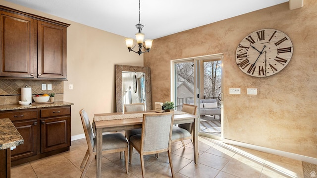 69 W Grove Creek Cir N, Farmington, UT 84025 - dining area with baseboards, light tile patterned floors, and a chandelier