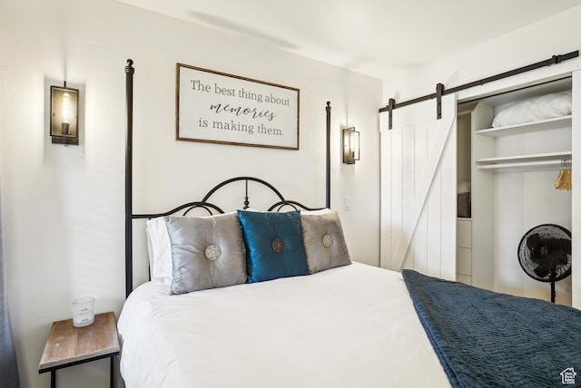 7035 N 2200 W Unit 3O, Park City, UT 84098 - bedroom featuring a barn door and a closet