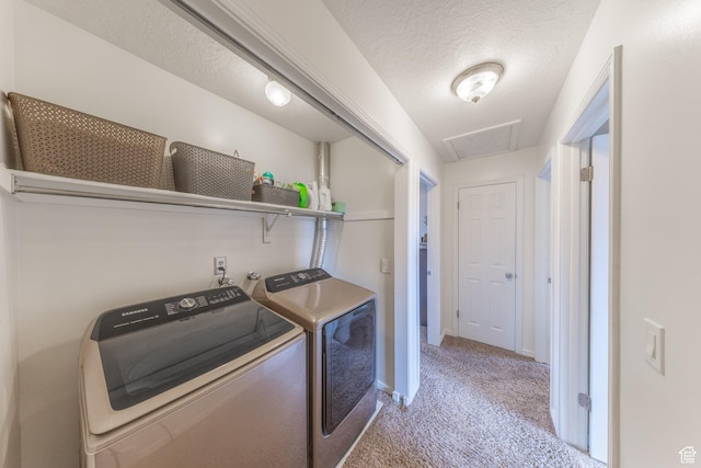 2350 N 720 W, Layton, UT 84041 - laundry area featuring washing machine and clothes dryer, a textured ceiling, carpet floors, baseboards, and laundry area