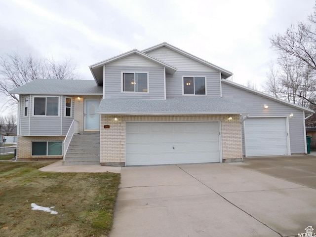 2350 N 720 W, Layton, UT 84041 - split level home with a garage, brick siding, and concrete driveway