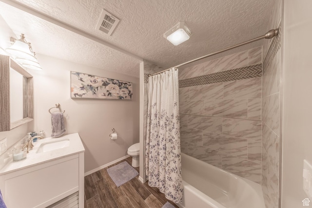 2350 N 720 W, Layton, UT 84041 - bathroom featuring wood finished floors, a textured ceiling, vanity, toilet, and visible vents