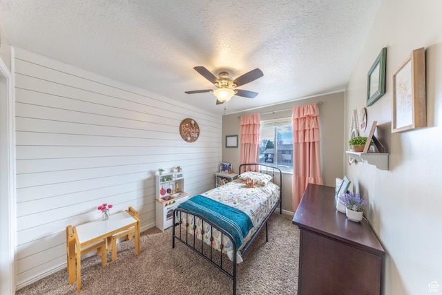 2350 N 720 W, Layton, UT 84041 - carpeted bedroom with wooden walls, a textured ceiling, and a ceiling fan