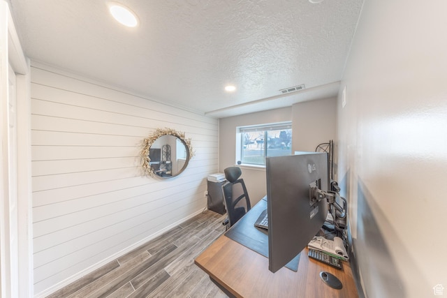 2350 N 720 W, Layton, UT 84041 - office area featuring wood walls, wood finished floors, visible vents, baseboards, and a textured ceiling