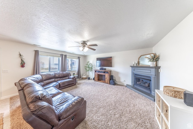 2350 N 720 W, Layton, UT 84041 - living room with a glass covered fireplace, carpet floors, a textured ceiling, and a ceiling fan