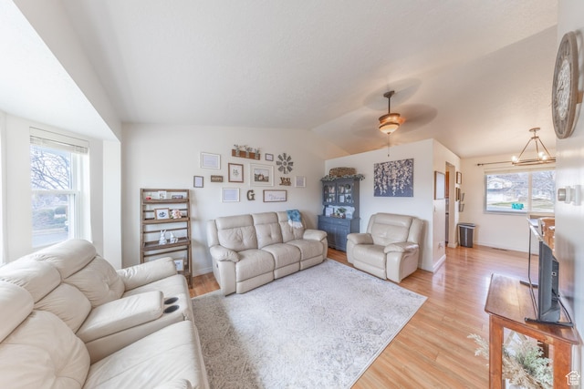 2350 N 720 W, Layton, UT 84041 - living room featuring lofted ceiling, light wood-style flooring, and plenty of natural light