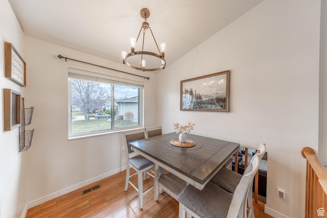 2350 N 720 W, Layton, UT 84041 - dining space with light wood-type flooring, baseboards, visible vents, a notable chandelier, and lofted ceiling