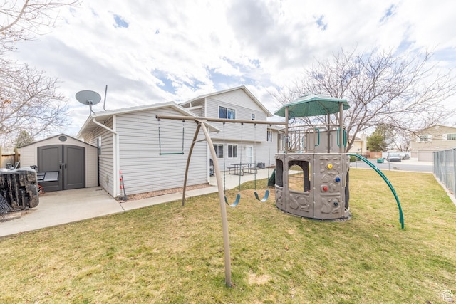 2350 N 720 W, Layton, UT 84041 - back of house featuring an outbuilding, a playground, fence, a yard, and a shed