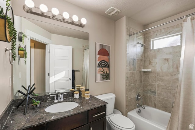 bathroom with visible vents, toilet, vanity, a textured ceiling, and shower / bathtub combination with curtain