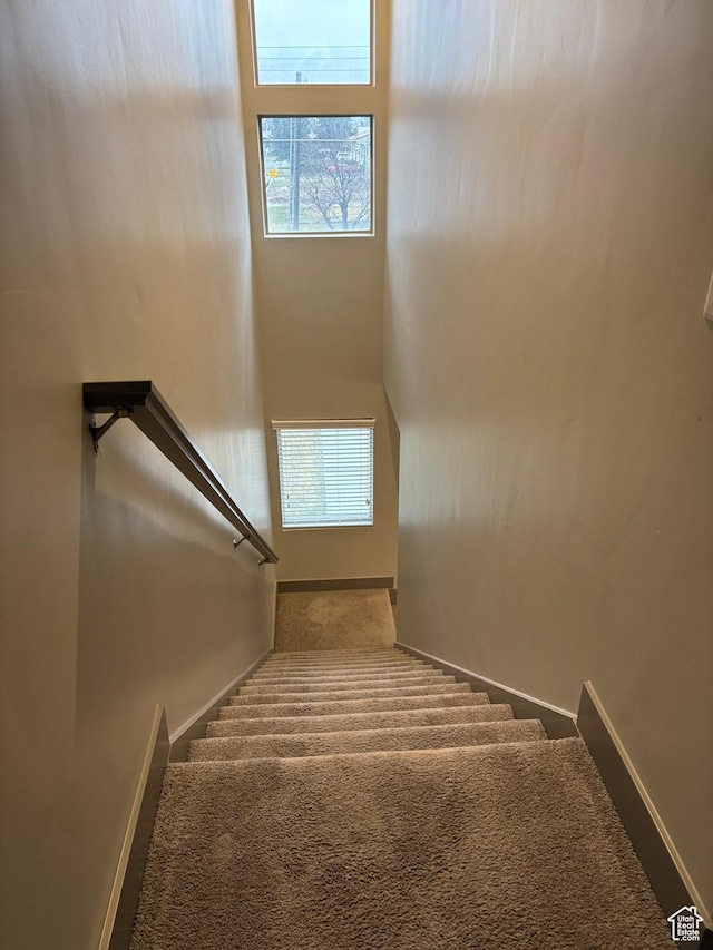 12734 S 1630 W, Riverton, UT 84065 - staircase featuring carpet floors, a wealth of natural light, and baseboards