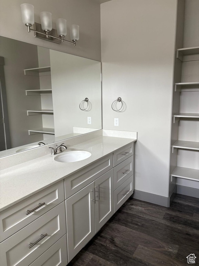 12734 S 1630 W, Riverton, UT 84065 - bathroom featuring vanity, baseboards, and wood finished floors