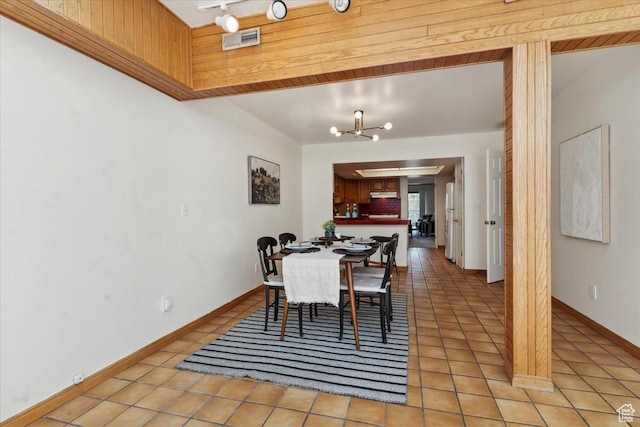 1231 E Brickyard Rd Unit 505, Millcreek, UT 84106 - dining space with light tile patterned floors and a chandelier