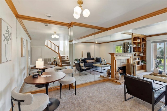 1231 E Brickyard Rd Unit 505, Millcreek, UT 84106 - living room with ornamental molding, stairway, a tile fireplace, and a chandelier