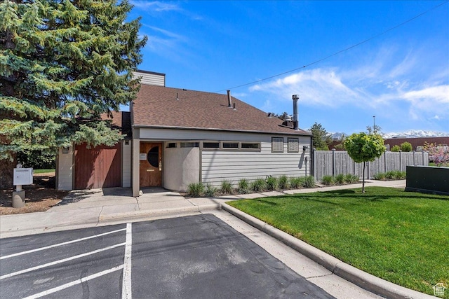 1231 E Brickyard Rd Unit 505, Millcreek, UT 84106 - view of front of property with uncovered parking and a shingled roof