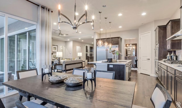 6211 W Wapiti Ridge Ln Unit 332, Herriman, UT 84096 - dining space featuring recessed lighting, a notable chandelier, and dark wood-style floors