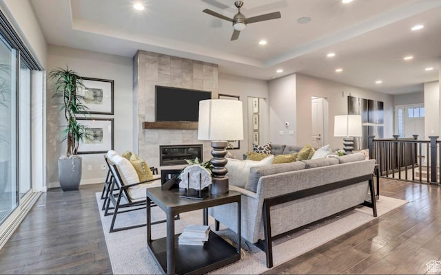 6211 W Wapiti Ridge Ln Unit 332, Herriman, UT 84096 - living area with recessed lighting, a raised ceiling, dark wood-type flooring, and a fireplace