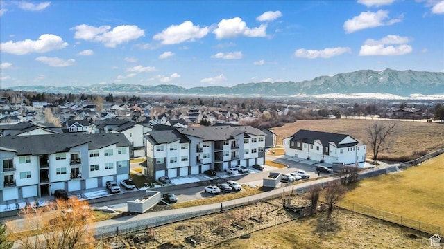 birds eye view of property with a mountain view and a residential view
