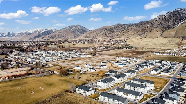 drone / aerial view with a residential view and a mountain view