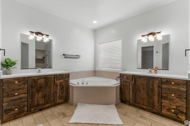 1639 E Yant Flant Dr, St George, UT 84790 - full bathroom featuring a sink, a garden tub, two vanities, and wood tiled floor