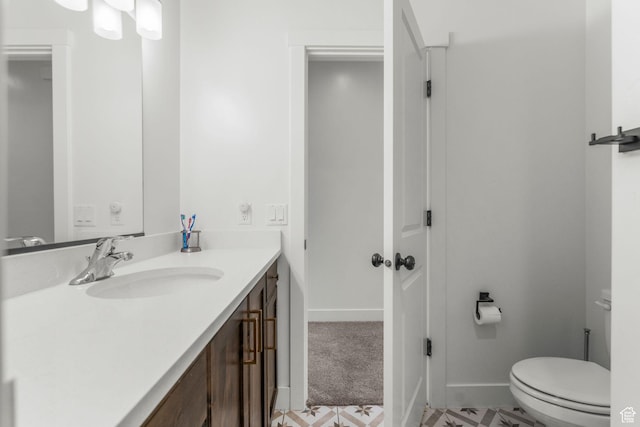 1639 E Yant Flant Dr, St George, UT 84790 - bathroom with baseboards, toilet, and vanity