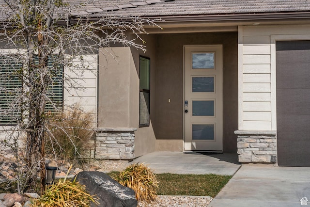 1639 E Yant Flant Dr, St George, UT 84790 - entrance to property featuring a garage, stone siding, and stucco siding