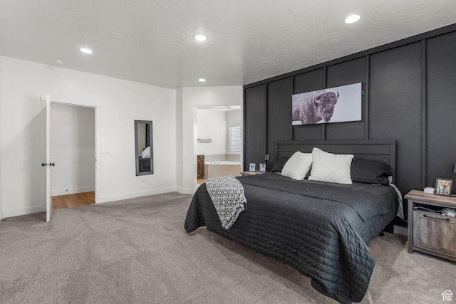 1639 E Yant Flant Dr, St George, UT 84790 - bedroom featuring baseboards, light carpet, recessed lighting, ensuite bathroom, and a textured ceiling
