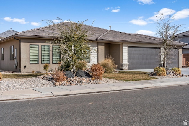 1639 E Yant Flant Dr, St George, UT 84790 - single story home featuring stone siding, stucco siding, concrete driveway, and a garage