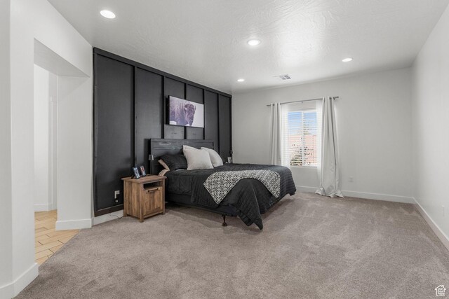 1639 E Yant Flant Dr, St George, UT 84790 - bedroom featuring a textured ceiling, recessed lighting, baseboards, and light carpet